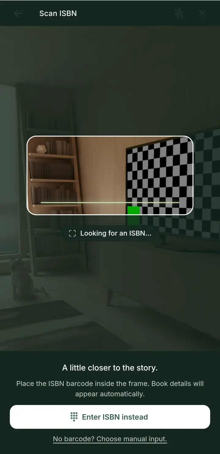 Scan ISBN screen with a camera frame looking for a barcode, plus choices to type an ISBN or add a book by hand.